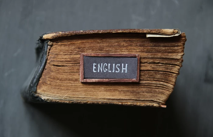 An old large sized book, with the word English on the front.