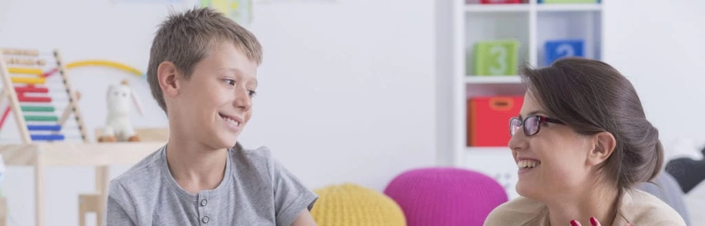 Mother and son, of a young age, studying together.