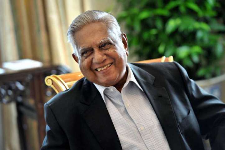 A photograph of Wolsey Hall Oxford alumnus SR Nathan, former President of Singapore. SR Nathan is sitting and smiling at someone off-camera and is wearing a suit with no tie, with short, combed-back grey hair. 