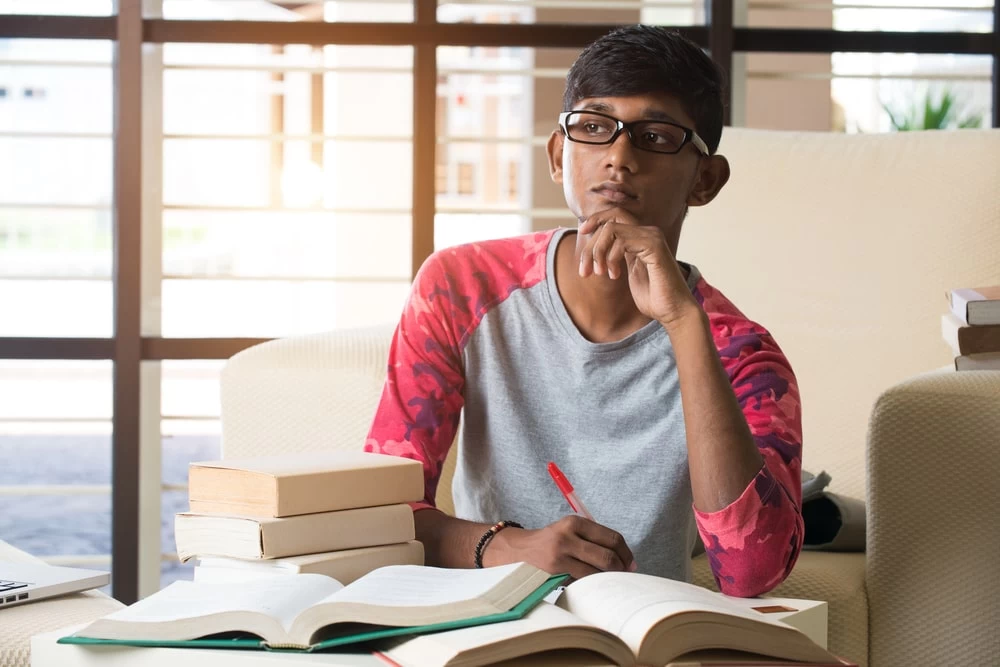 A GCSE Level English student pondering whilst thinking what to write next. 