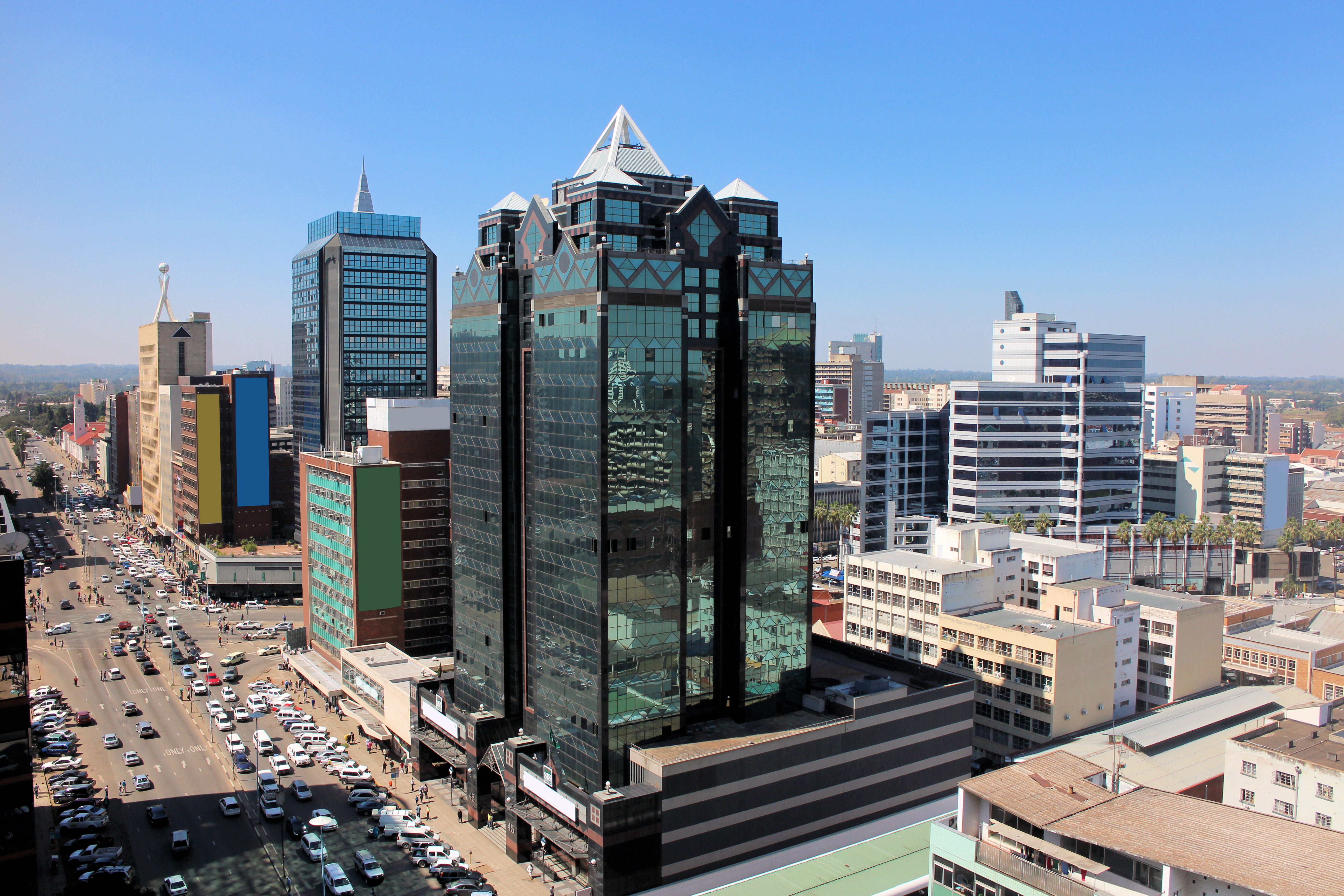 Daytime view of central Harare with modern high-rise buildings and busy traffic