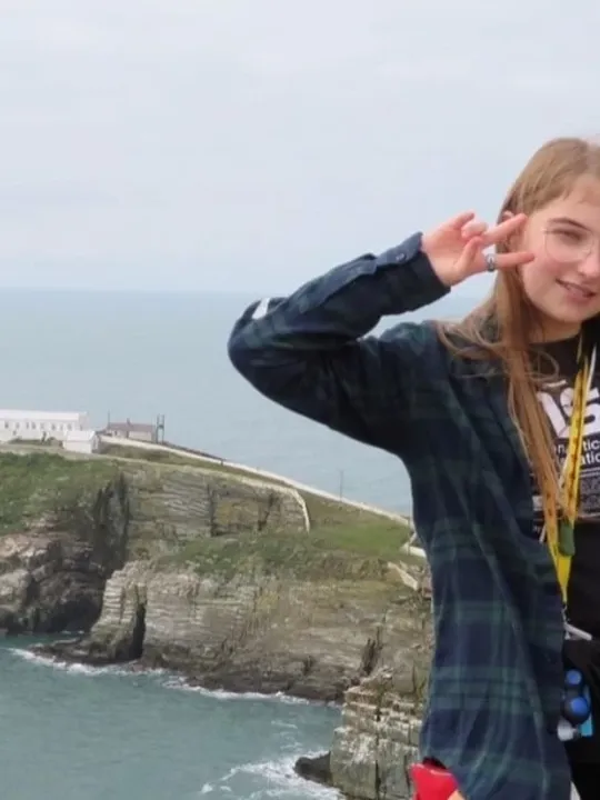 Wolsey Hall Oxford student, Lily, on a cliff.