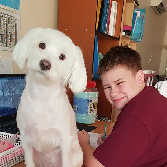 Wolsey Hall Oxford student, Kaelem, and his dog.