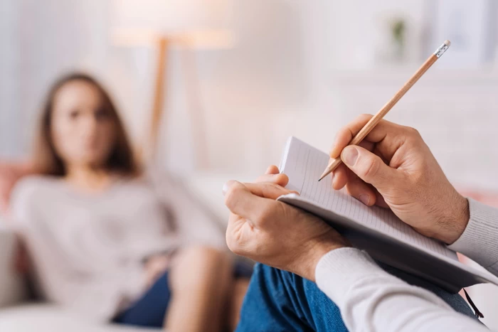 A close up of a therapists note pad, when they are in session with one of their patients. 