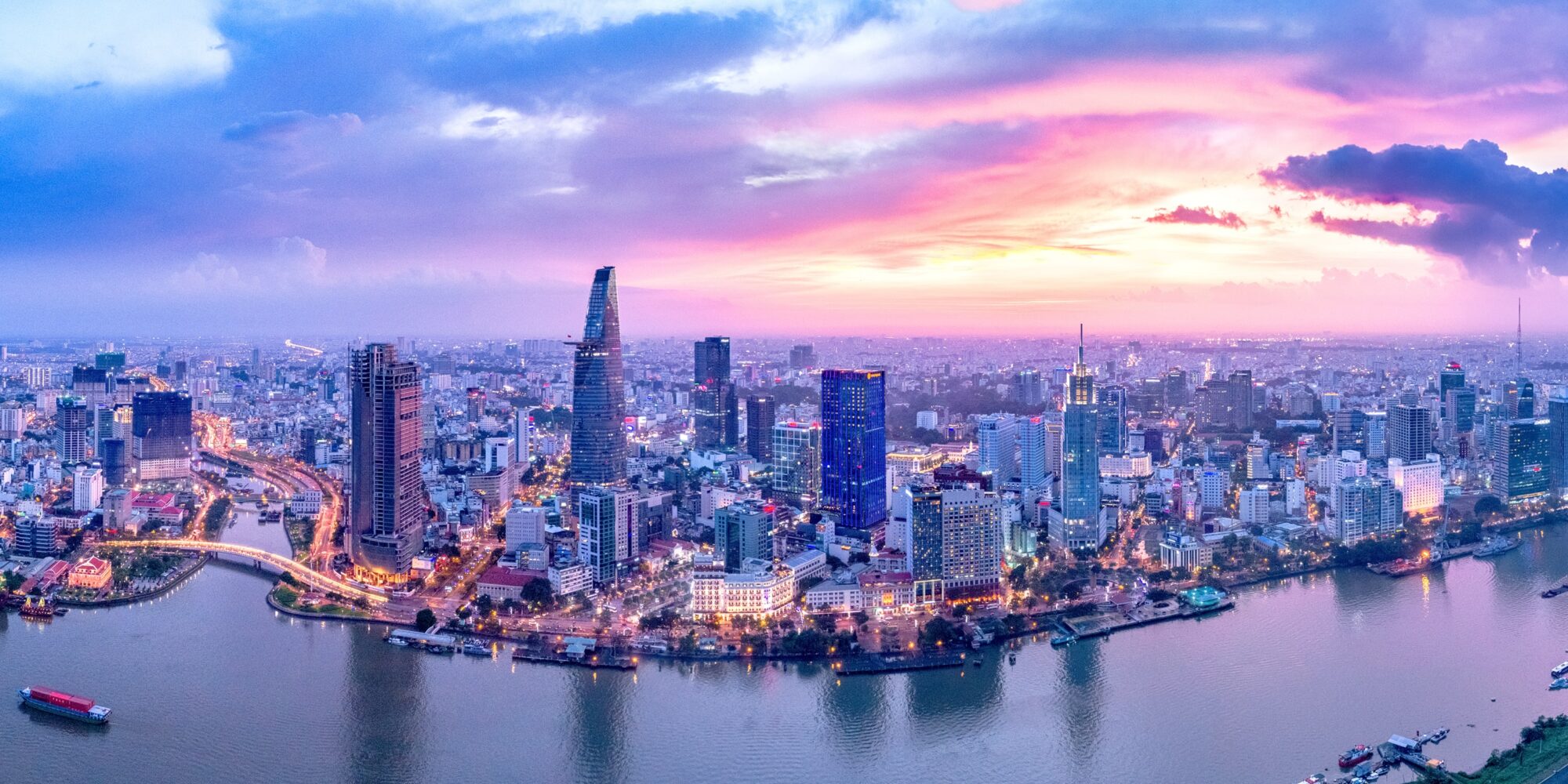 Landscape of a Vietnamese skyline with a very pink and blue sunset. 