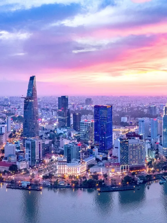 Landscape of a Vietnamese skyline with a very pink and blue sunset.