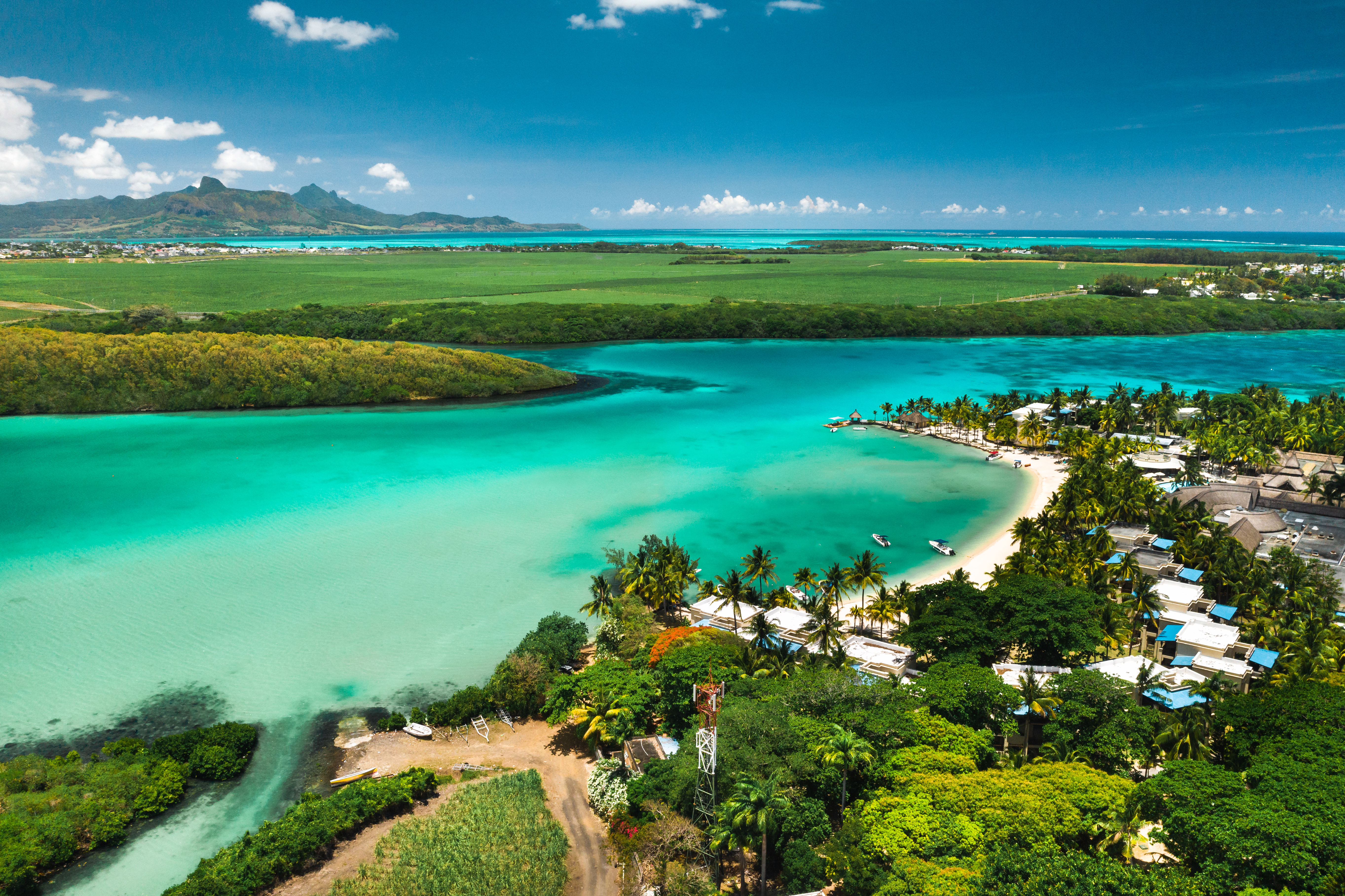 Aerial view of turquoise lagoon and palm-fringed coastline in Mauritius