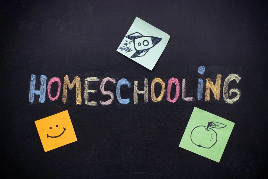 Homeschooling written out on a blackboard.