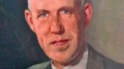 A close-up portrait painting of Wolsey Hall Oxford founder Joseph William Knipe. Joseph is smiling at the camera and is wearing a suit, with short grey hair.