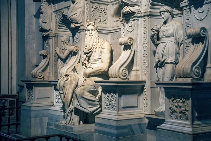 An old Roman statue made from polished marble or granite. 