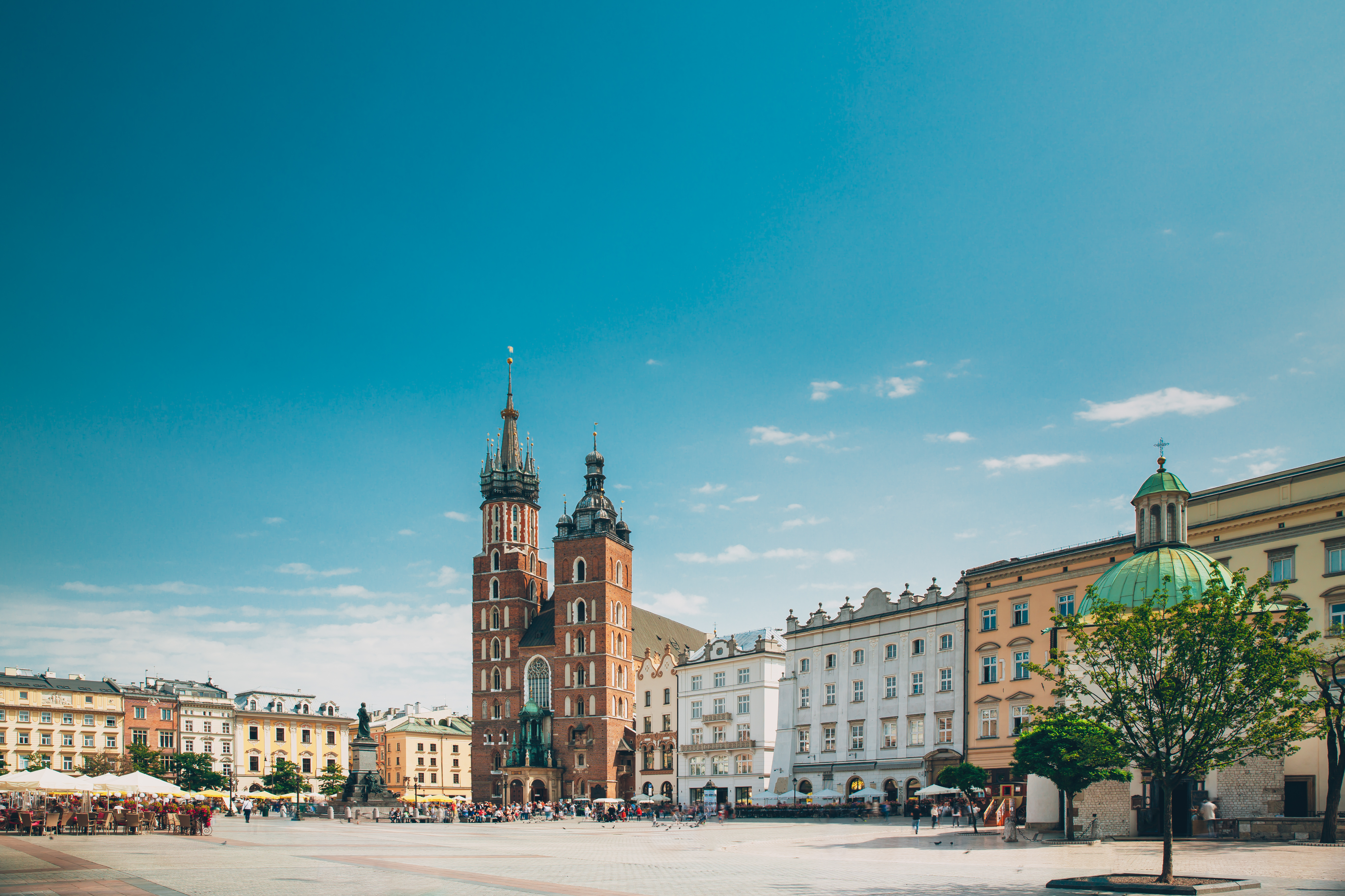 Historic square in Kraków, Poland, with St Mary’s Basilica and surrounding architecture