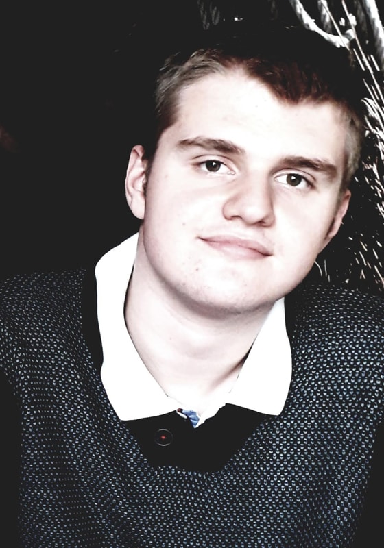 Wolsey Hall Oxford student Rafael smiles at the camera after being awarded Outstanding Cambridge Learner Award.